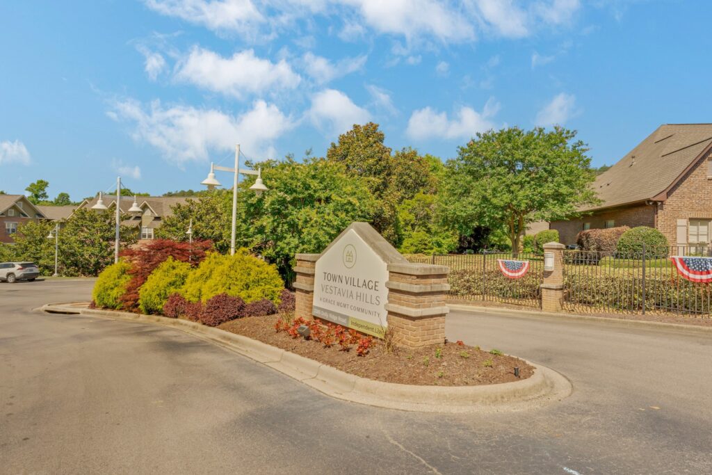 AL101282_2385_Dolly_Ridge_Vestavia_20220531_001 - Town Village Vestavia Hills Town Village Vestavia Hills main driveway entrance with a sign.